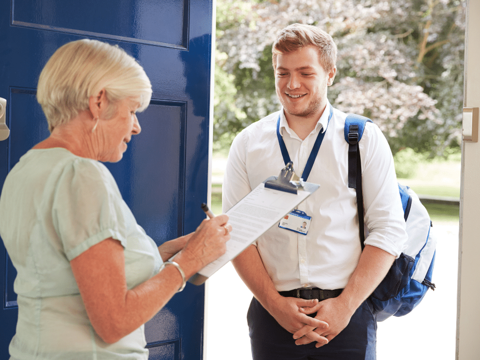 Woman verifies credentials of young man at door